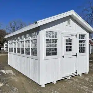 10x16 classic white greenhouse with clear panel roof and rows of large windows on all sides.