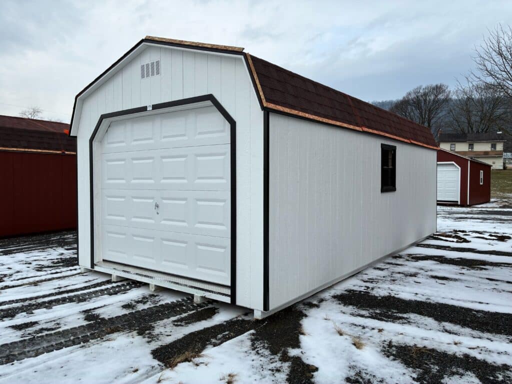 Exterior view of a 12x24 Smartside Dutch Garage, Model 2034S, painted white with black trim, black shingled roof, and a white garage door.