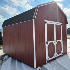 Side angle of 10x12 red Carolina Dutch shed with white double doors and black roof