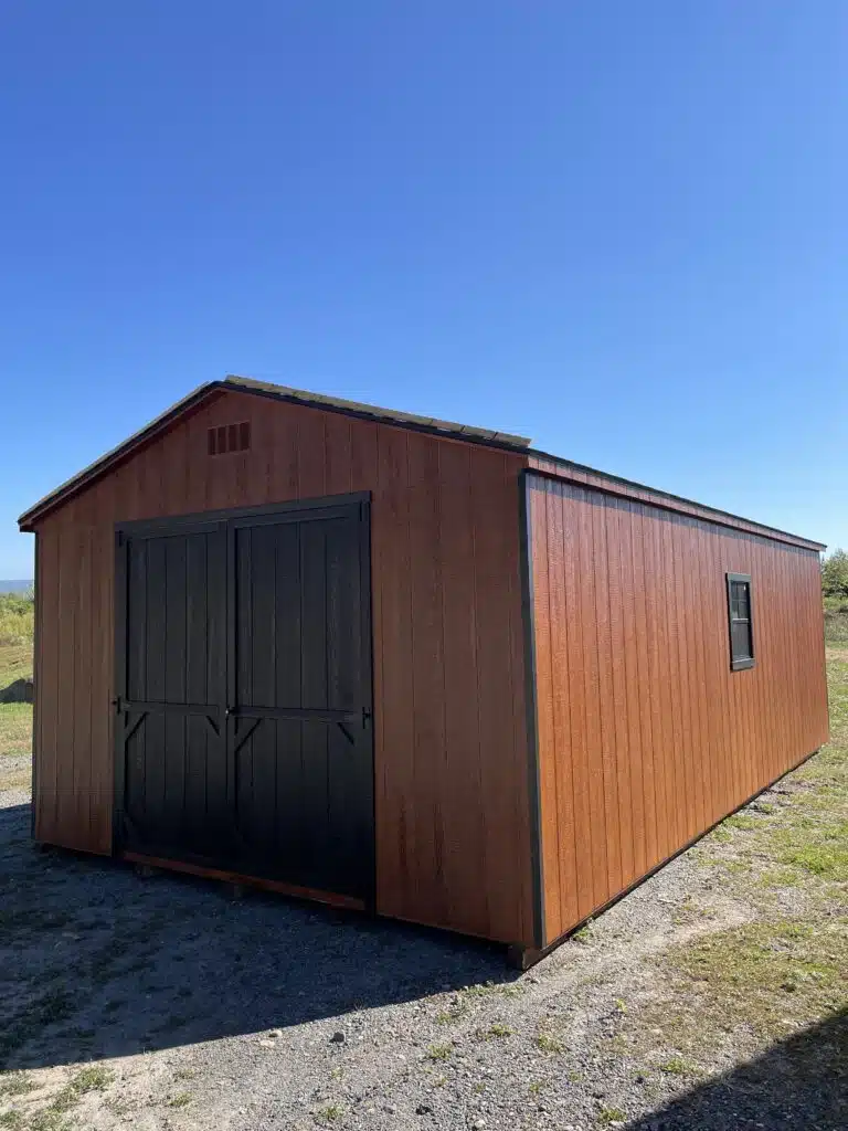 Side view of a 14x26 redwood Smartside A-Frame garage with black double doors, black trim, and a black-trimmed window.