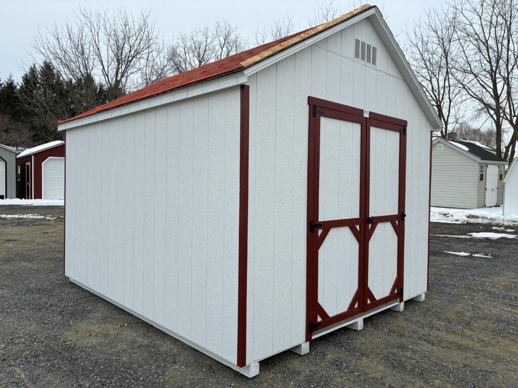 Interior of 10x12 Carolina A Frame shed with unfinished wood and window Interior View – 10x12 Carolina A Frame Shed