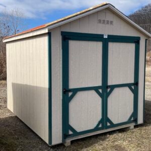 32106-S 8x10 Carolina Cottage in GP Tan with Hunter Green trim, Driftwood roof, and 6x6 double door front view.