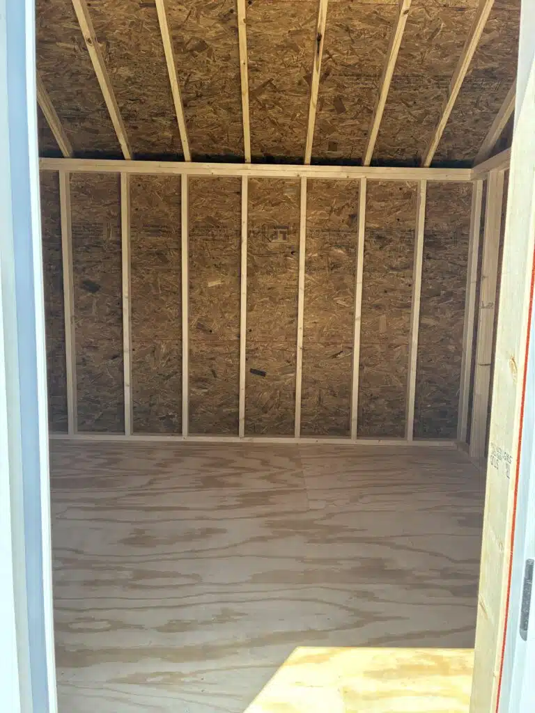 Interior of a 12x24 barn garage with rubber floor, 4 foot loft, and full ridge vent