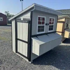 Side view of a 4x6 lean-to chicken coop in Gap Gray with black trim, two windows, and a single access door.