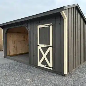 Side view of a 10x16 run-in shed in Urban Bronze with Ivory trim, antique slate shingles, open shelter bay, and tack room door