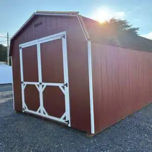 Red 12x16 Carolina Dutch Barn shed with white trim, black shingles, and 7x7 double doors