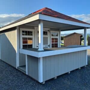 Side view of a 10x16 Classic Pool House with a 2-foot bar, vinyl post sleeves, transom windows, and hip-style roof