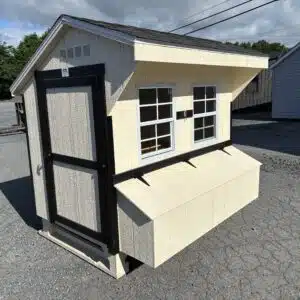 4x6 Quaker chicken coop in Navajo White with black trim, two windows, and exterior nesting box