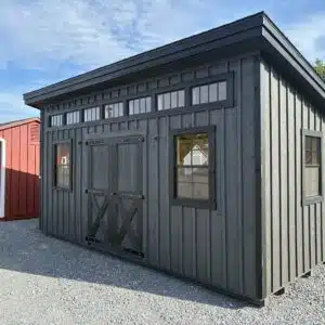 Side view of a Mobboard Black 10x18 Manor Series shed with black tinted transom windows and 24x36 black windows