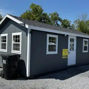 Dark gray 10x25 Classic A-Frame office shed with white trim, dual black roof, and multiple insulated windows.