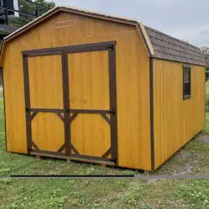 12x16 Carolina Dutch Barn shed in Golden Wheat with brown trim, dual brown roof, and double doors with ramp